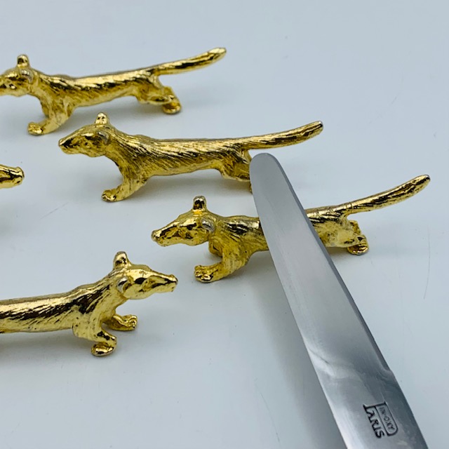 Porte couteaux chiens dorés